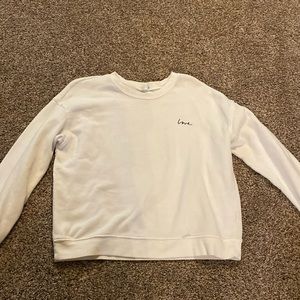 White “love” crewneck from H&M